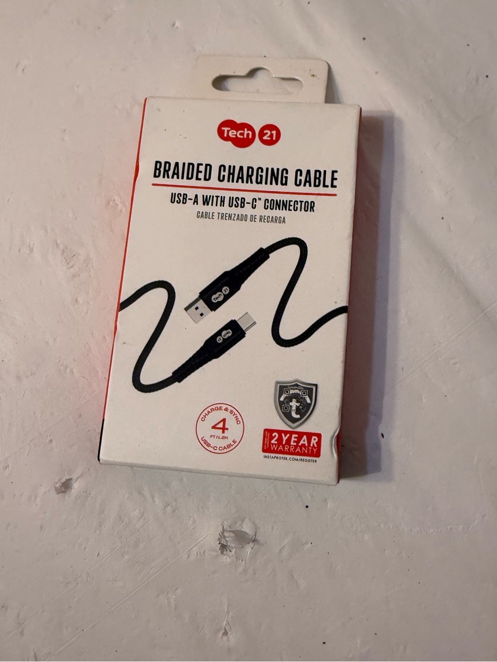 Tech21 brand braided charging cable that features a USB-A to USB-C connector